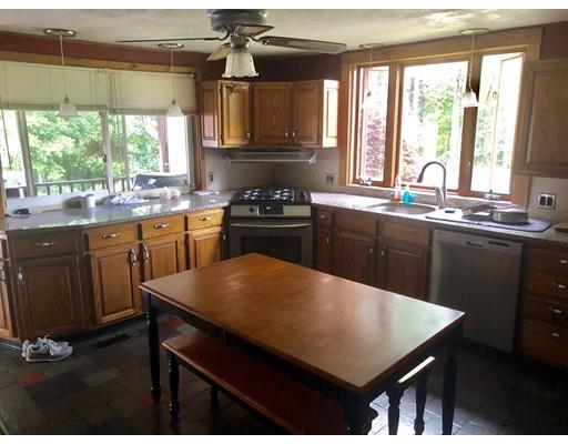 141 Center Road Gill, MA 01354 - Photo 13 of 37 a kitchen with a stove a sink and a refrigerator