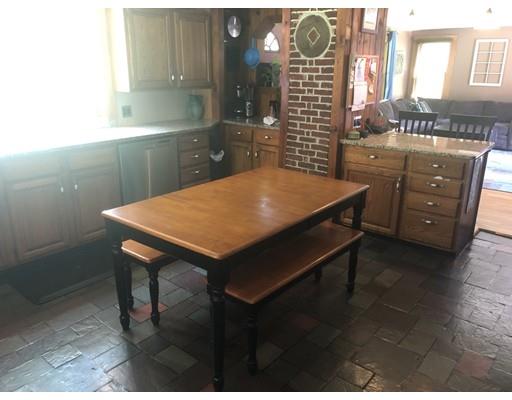 141 Center Road Gill, MA 01354 - Photo 18 of 37 a room with a table chairs and wooden cabinets