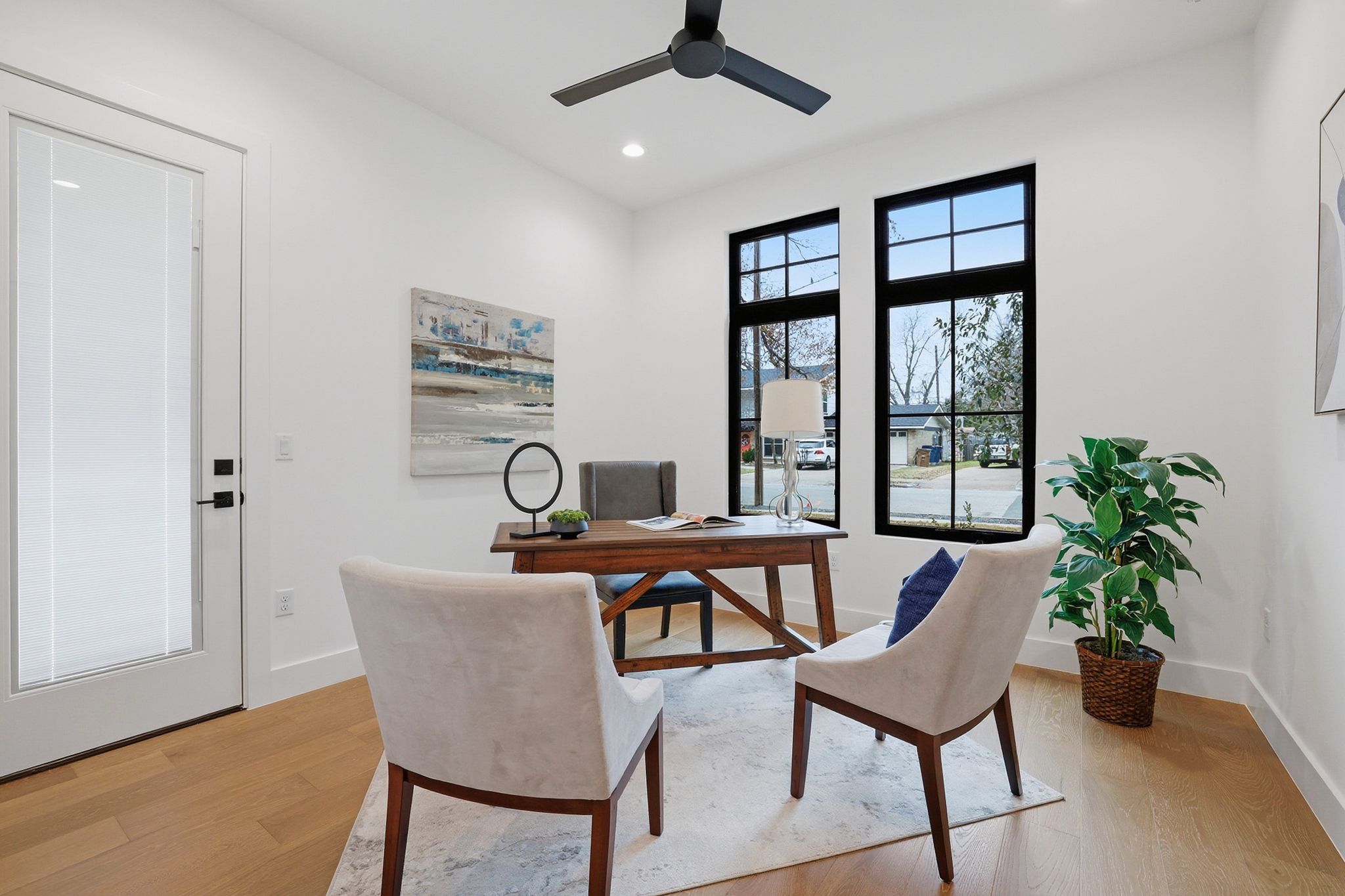 6611 Lexington Road Austin, TX 78757 - Photo 5 of 37 Dedicated workspace featuring wood-finish flooring and bright white walls