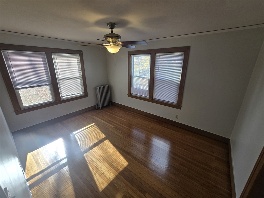 40 Catalpa Terrace Springfield, MA 01119 - Photo 24 of 24 a view of an empty room with wooden floor and a window