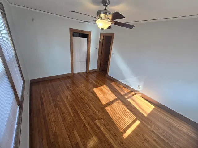 a view of room with wooden floor