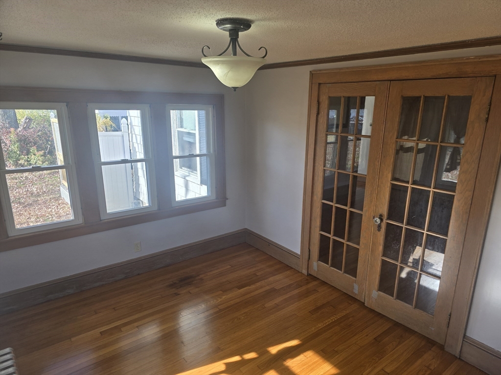 40 Catalpa Terrace Springfield, MA 01119 - Photo 9 of 24 a view of empty room with wooden floor and fan