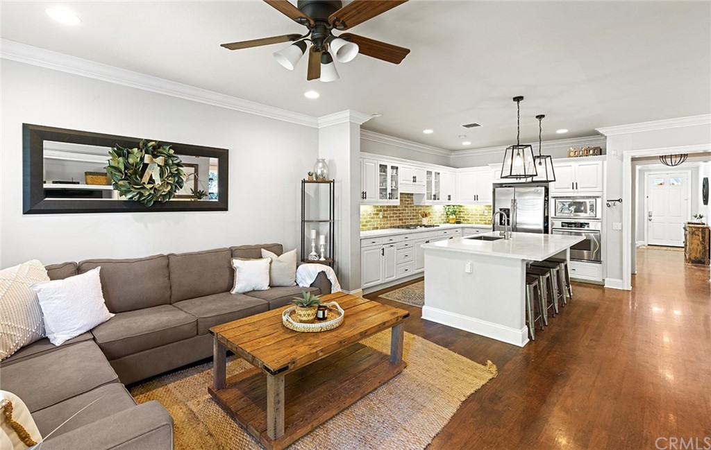 6 Pomegranate Street Ladera Ranch, CA 92694 - Photo 12 of 40 a kitchen with stainless steel appliances kitchen island granite countertop a sink stove and cabinets