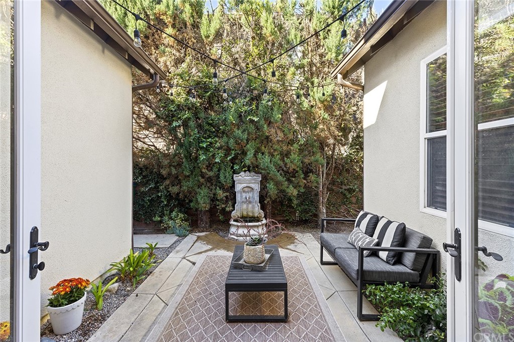 6 Pomegranate Street Ladera Ranch, CA 92694 - Photo 13 of 40 a living room with furniture fireplace and a large window