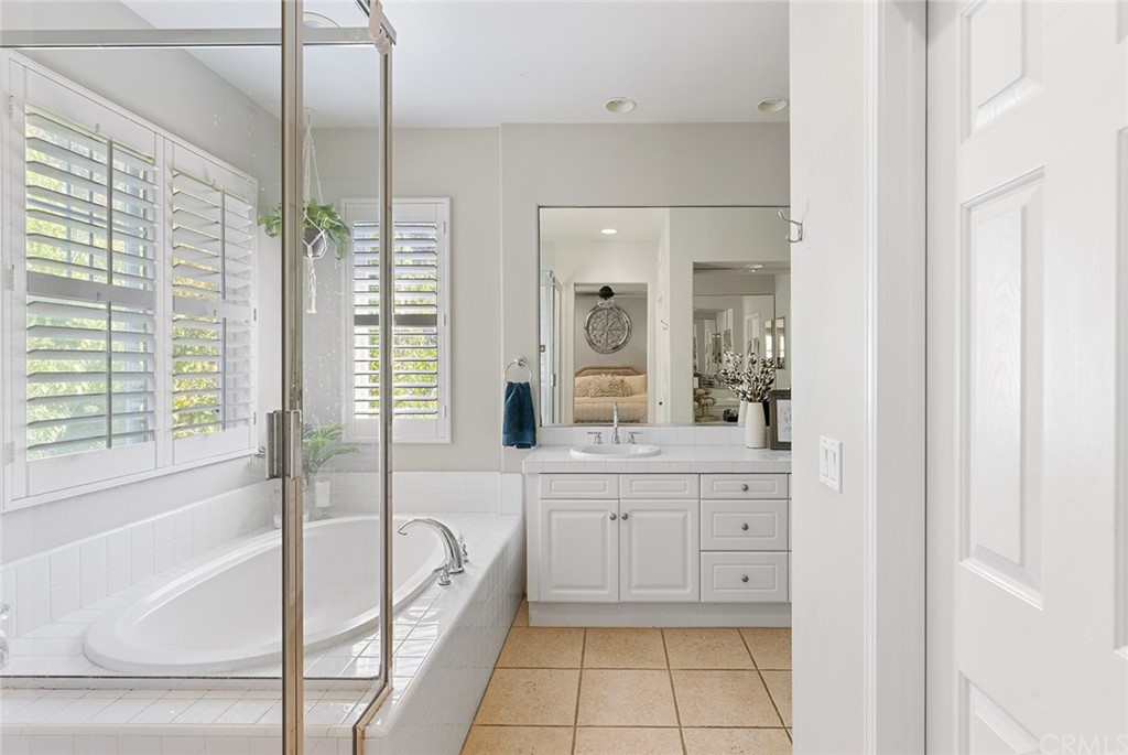 6 Pomegranate Street Ladera Ranch, CA 92694 - Photo 16 of 40 a bedroom with a bed and a tv on table