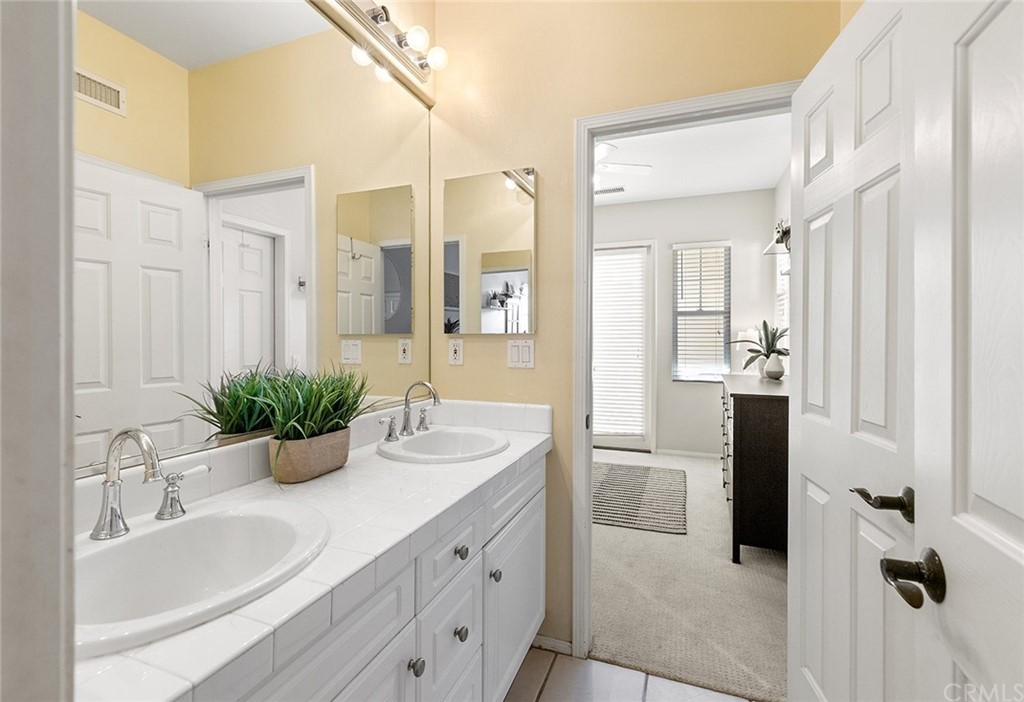 6 Pomegranate Street Ladera Ranch, CA 92694 - Photo 23 of 40 a bedroom with a bed and wooden floor