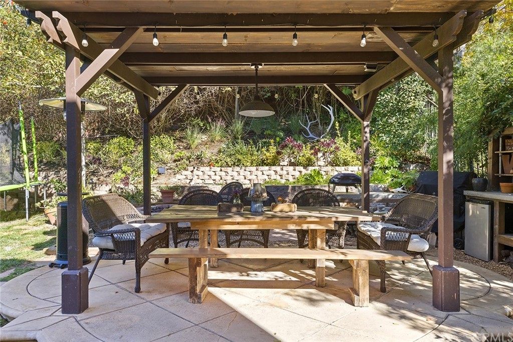 6 Pomegranate Street Ladera Ranch, CA 92694 - Photo 26 of 40 a kitchen with cabinets and wooden floor
