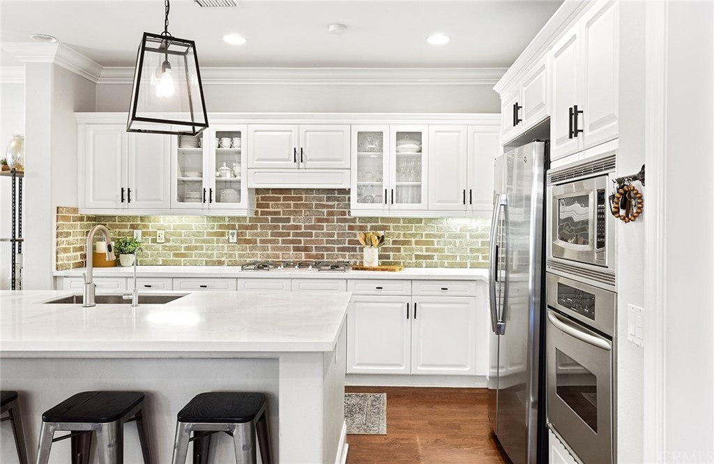6 Pomegranate Street Ladera Ranch, CA 92694 - Photo 7 of 40 a dining room with furniture potted plants and wooden floor