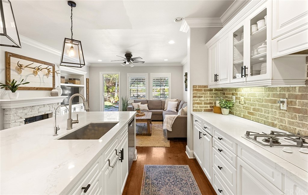 6 Pomegranate Street Ladera Ranch, CA 92694 - Photo 10 of 40 a living room with stainless steel appliances granite countertop furniture and a wooden floor
