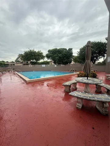 a view of a patio with swimming pool