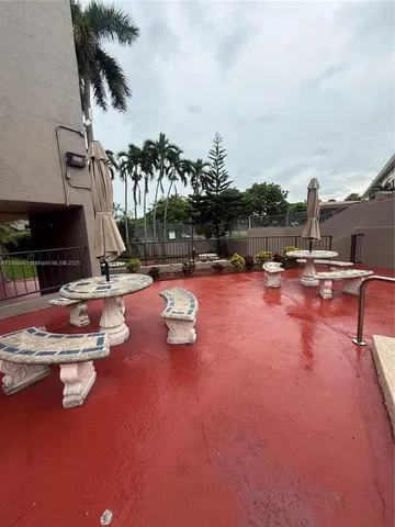 a view of outdoor space with swimming pool and patio