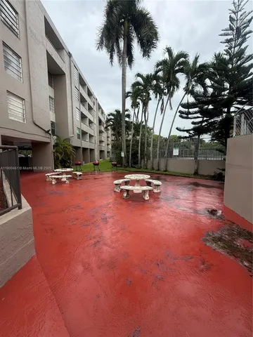 a view of a house with plants and garden