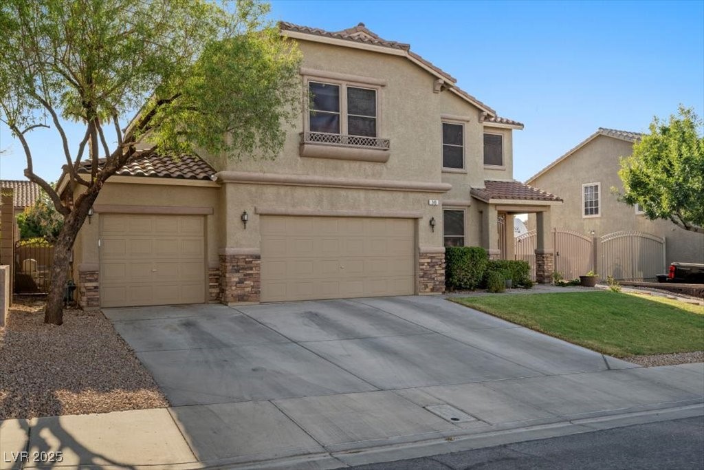 249 Cinnamon Ridge Way Henderson, NV 89015 - Photo 53 of 76 Mediterranean / spanish home with a tiled roof, stucco siding, stone siding, and concrete driveway