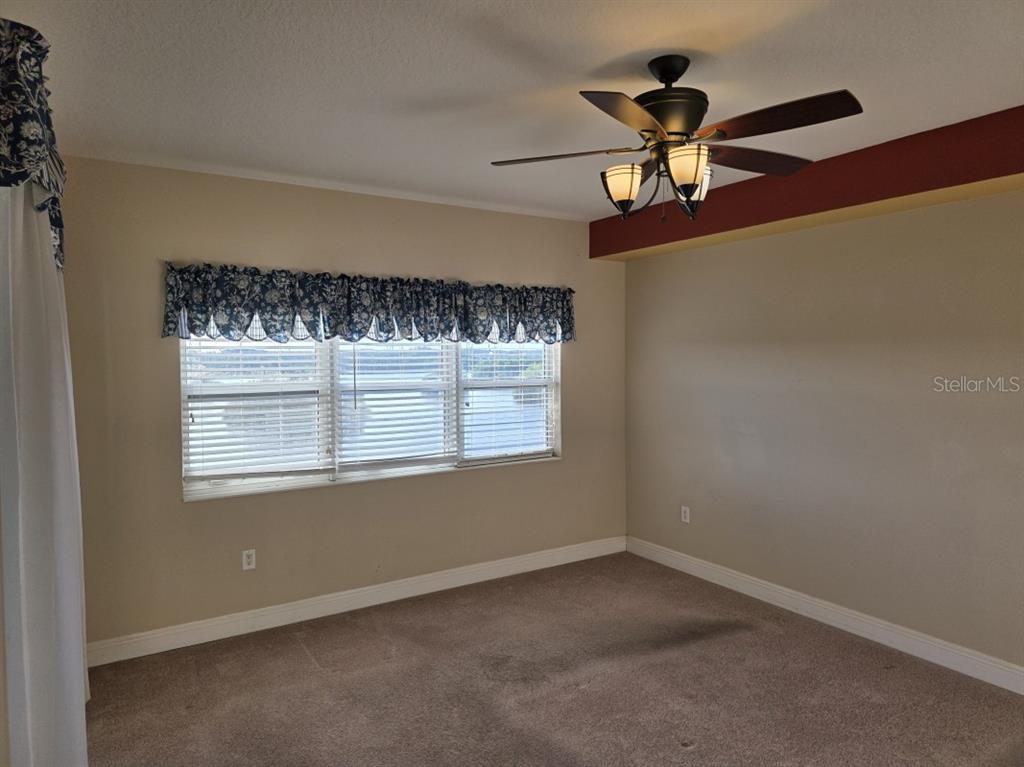 7070 Key Haven Road, Unit 402 Seminole, FL 33777 - Photo 18 of 34 a view of an empty room with a window