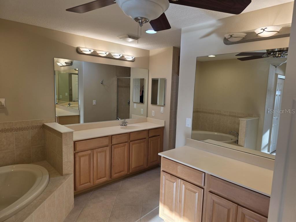 7070 Key Haven Road, Unit 402 Seminole, FL 33777 - Photo 21 of 34 a bathroom with a sink a toilet and shower