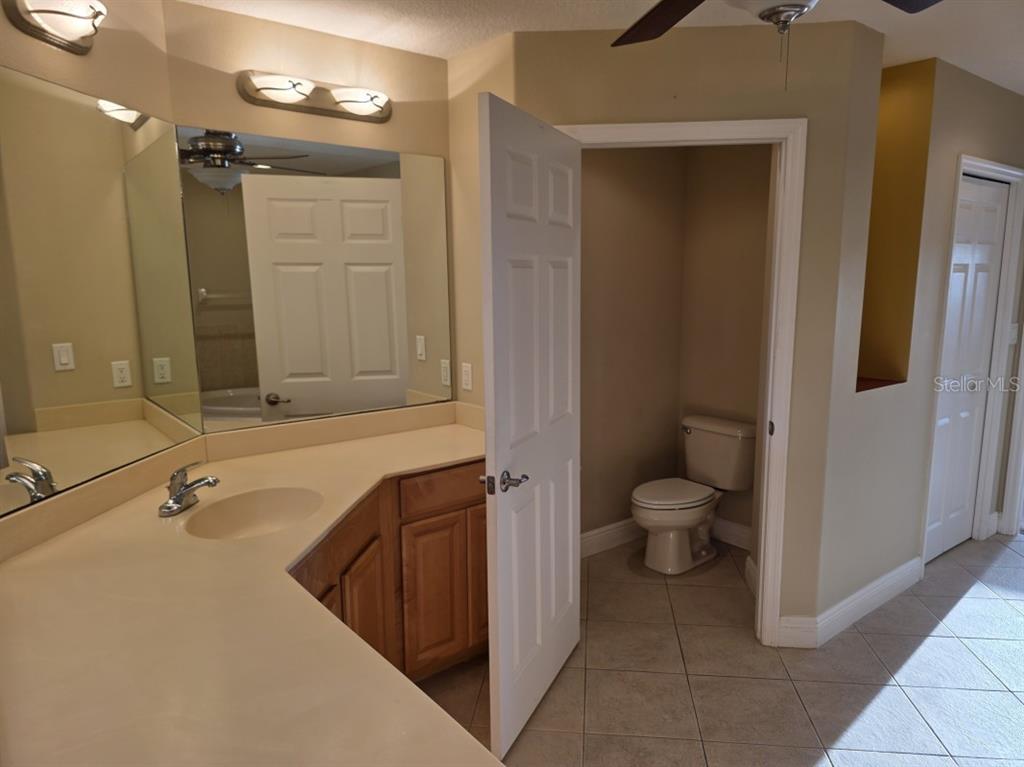 7070 Key Haven Road, Unit 402 Seminole, FL 33777 - Photo 22 of 34 a bathroom with a sink a toilet and shower