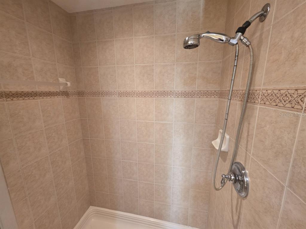7070 Key Haven Road, Unit 402 Seminole, FL 33777 - Photo 24 of 34 a bathroom with a shower