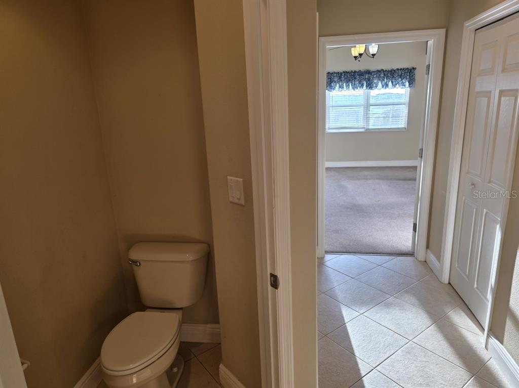 7070 Key Haven Road, Unit 402 Seminole, FL 33777 - Photo 25 of 34 a white toilet sitting next to a shower