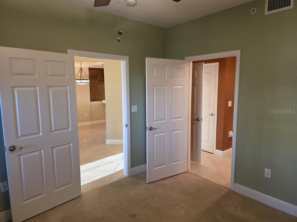 7070 Key Haven Road, Unit 402 Seminole, FL 33777 - Photo 26 of 34 an empty room with windows