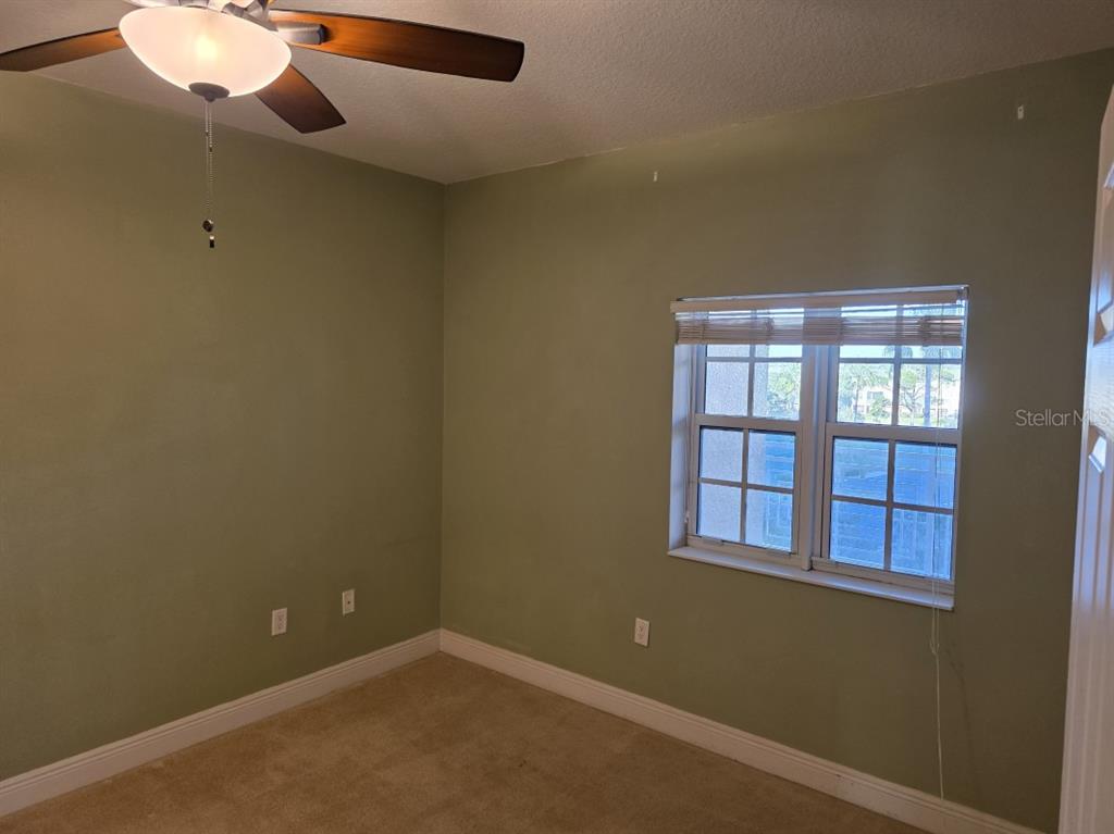 7070 Key Haven Road, Unit 402 Seminole, FL 33777 - Photo 27 of 34 an empty room with windows