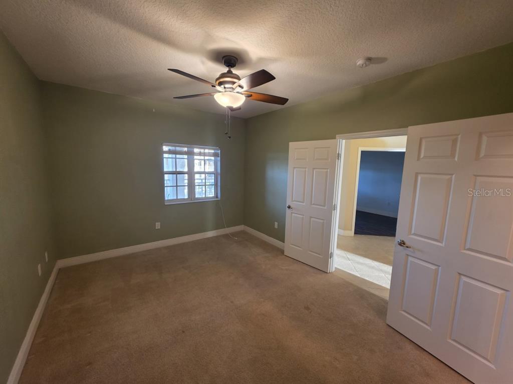 7070 Key Haven Road, Unit 402 Seminole, FL 33777 - Photo 28 of 34 a view of empty room with windows