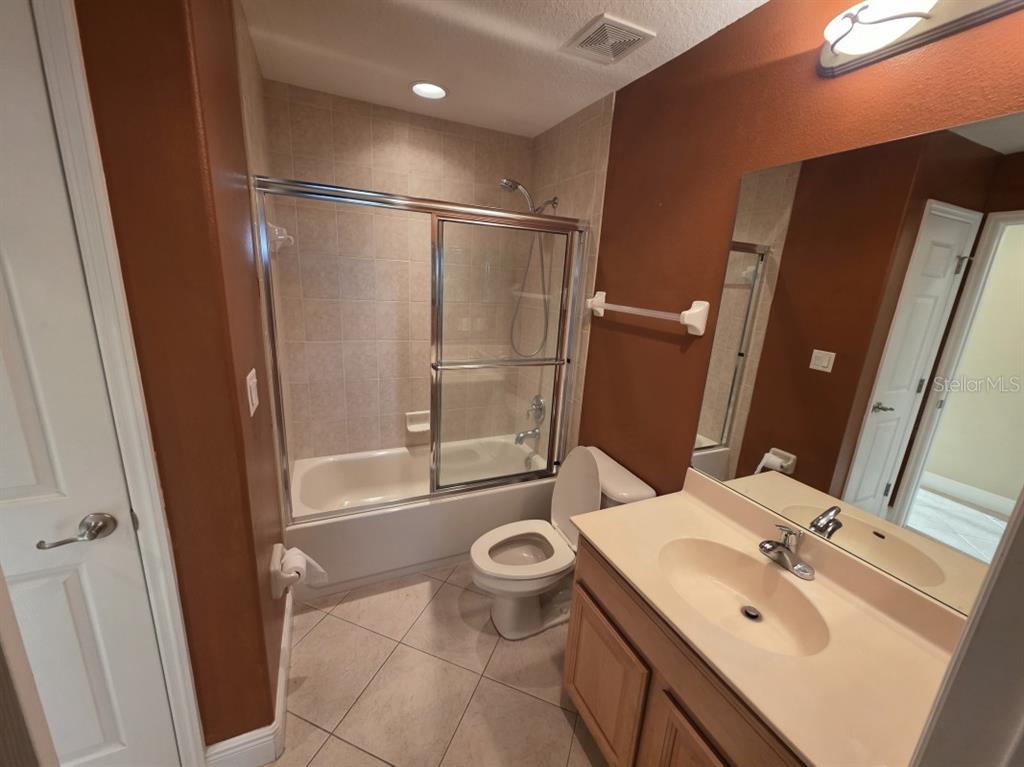 7070 Key Haven Road, Unit 402 Seminole, FL 33777 - Photo 30 of 34 a bathroom with a sink a toilet and shower
