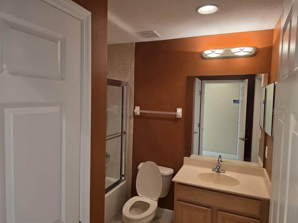 7070 Key Haven Road, Unit 402 Seminole, FL 33777 - Photo 31 of 34 a bathroom with a sink and a mirror