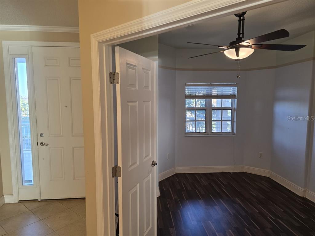7070 Key Haven Road, Unit 402 Seminole, FL 33777 - Photo 32 of 34 a view of empty room with wooden floor and fan