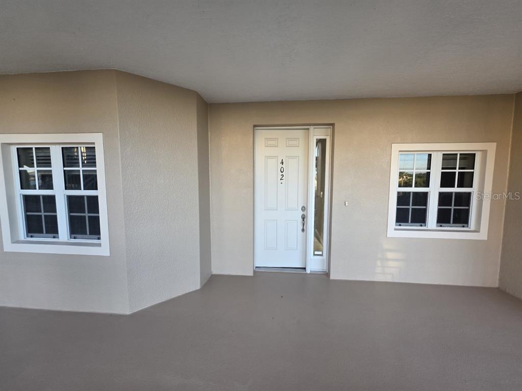 7070 Key Haven Road, Unit 402 Seminole, FL 33777 - Photo 5 of 34 a view of an empty room with a window