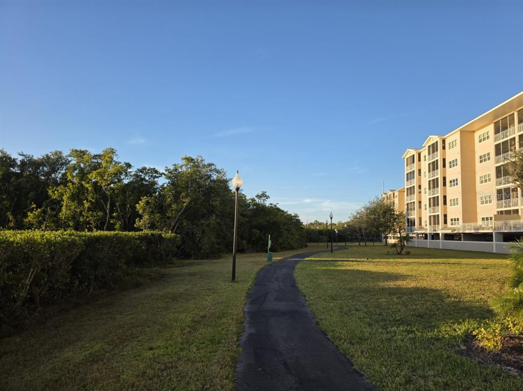 7070 Key Haven Road, Unit 402 Seminole, FL 33777 - Photo 8 of 34 a view of a big building with a big yard