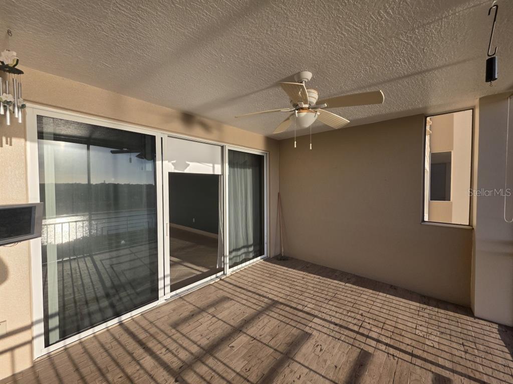 7070 Key Haven Road, Unit 402 Seminole, FL 33777 - Photo 10 of 34 a bedroom with a bed and a chandelier