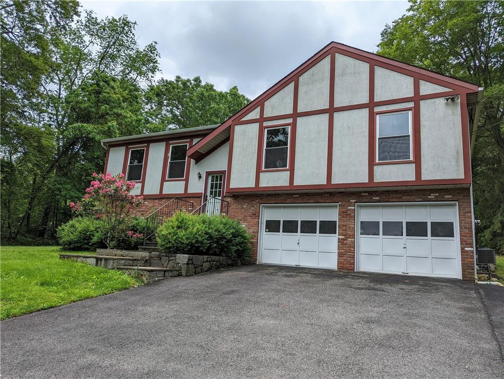 Front showing extra wide driveway. Not shown parking for 3 additional cars.