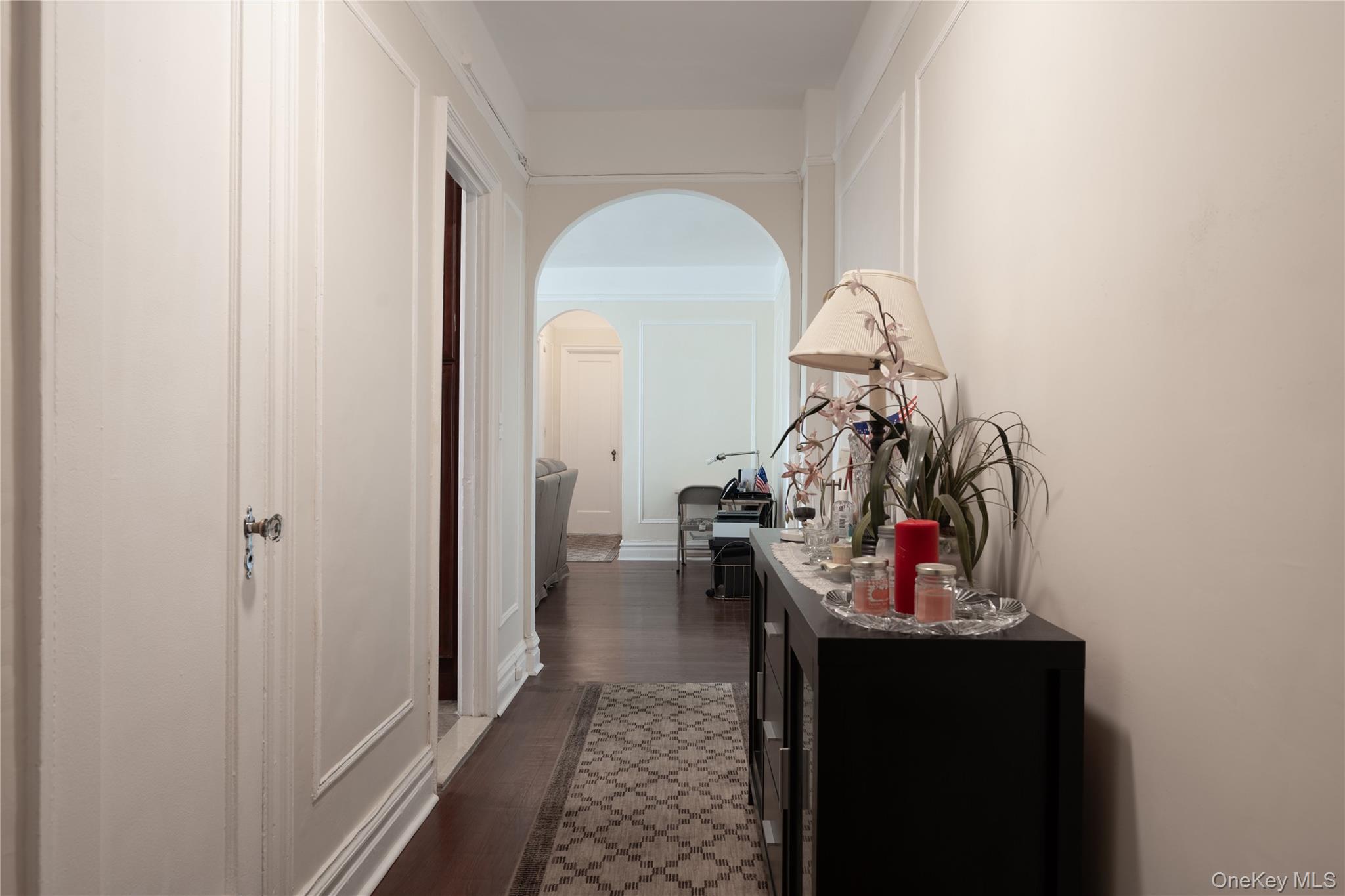 1468 Midland Avenue, Unit 4D Bronxville, NY 10708 - Photo 11 of 24 Corridor featuring arched walkways and dark wood-style flooring