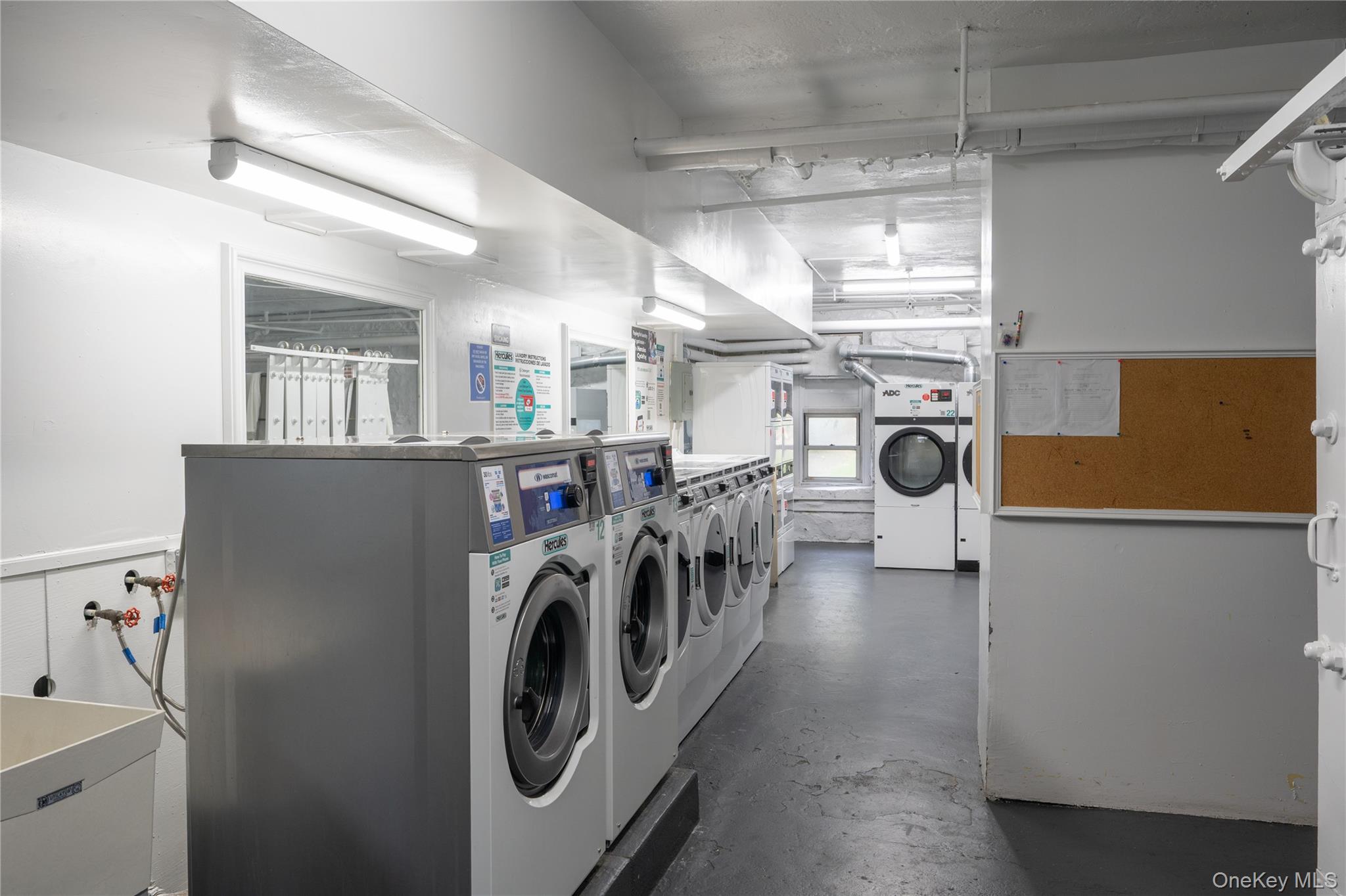 1468 Midland Avenue, Unit 4D Bronxville, NY 10708 - Photo 20 of 24 Community laundry with separate washer and dryer