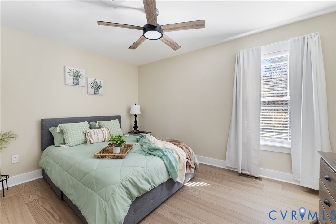 13545 Prince George Drive Disputanta, VA 23842 - Photo 11 of 18 Bedroom featuring light wood-style floors and a ce