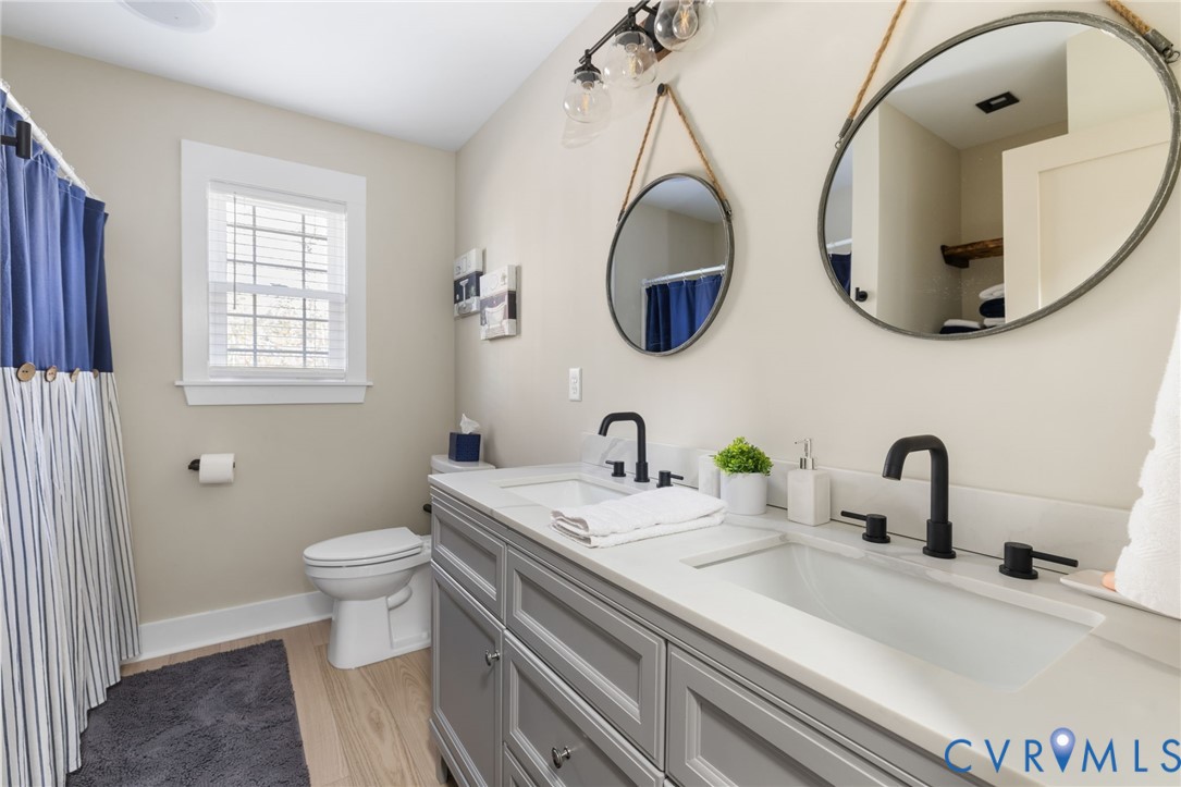 13545 Prince George Drive Disputanta, VA 23842 - Photo 13 of 18 Full bathroom with double vanity, a shower with sh