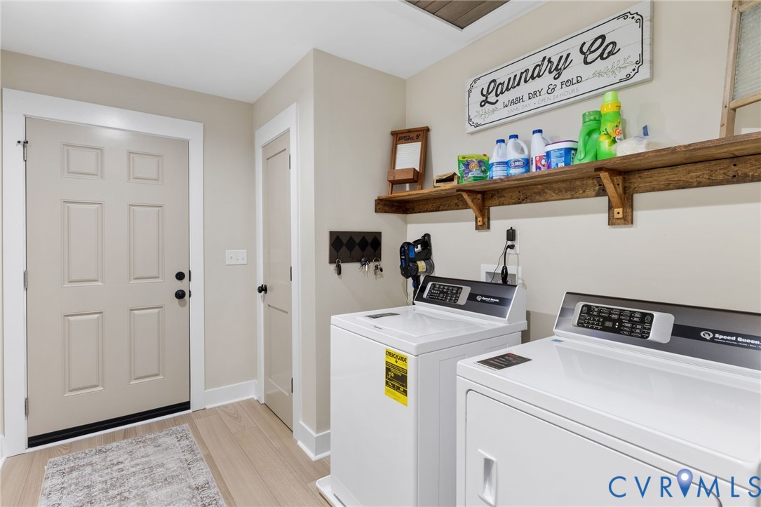13545 Prince George Drive Disputanta, VA 23842 - Photo 15 of 18 Laundry room with light wood-style floors and wash