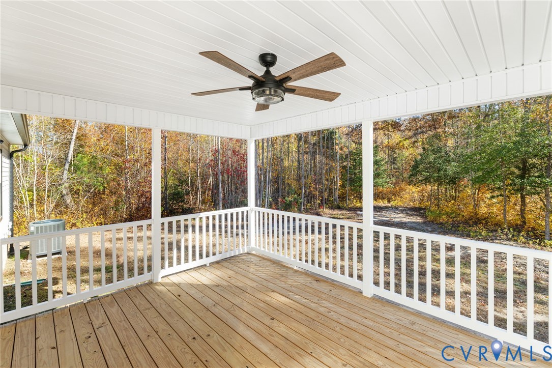 13545 Prince George Drive Disputanta, VA 23842 - Photo 16 of 18 Wooden terrace with a ceiling fan and view of scat