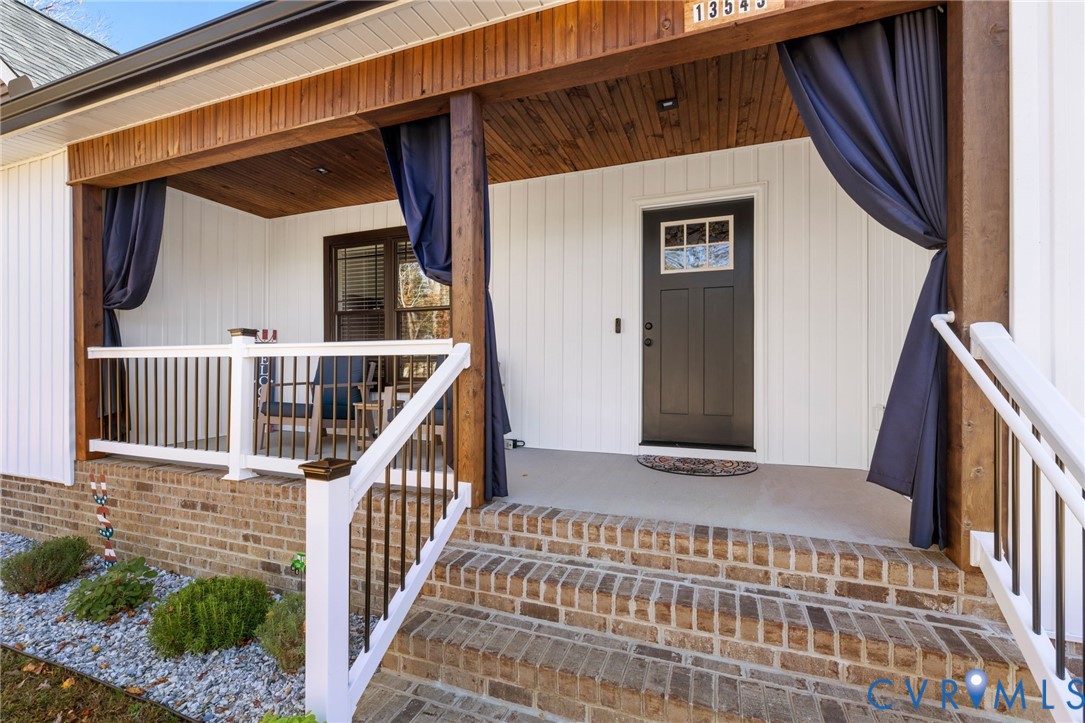 13545 Prince George Drive Disputanta, VA 23842 - Photo 2 of 18 View of exterior entry featuring covered porch