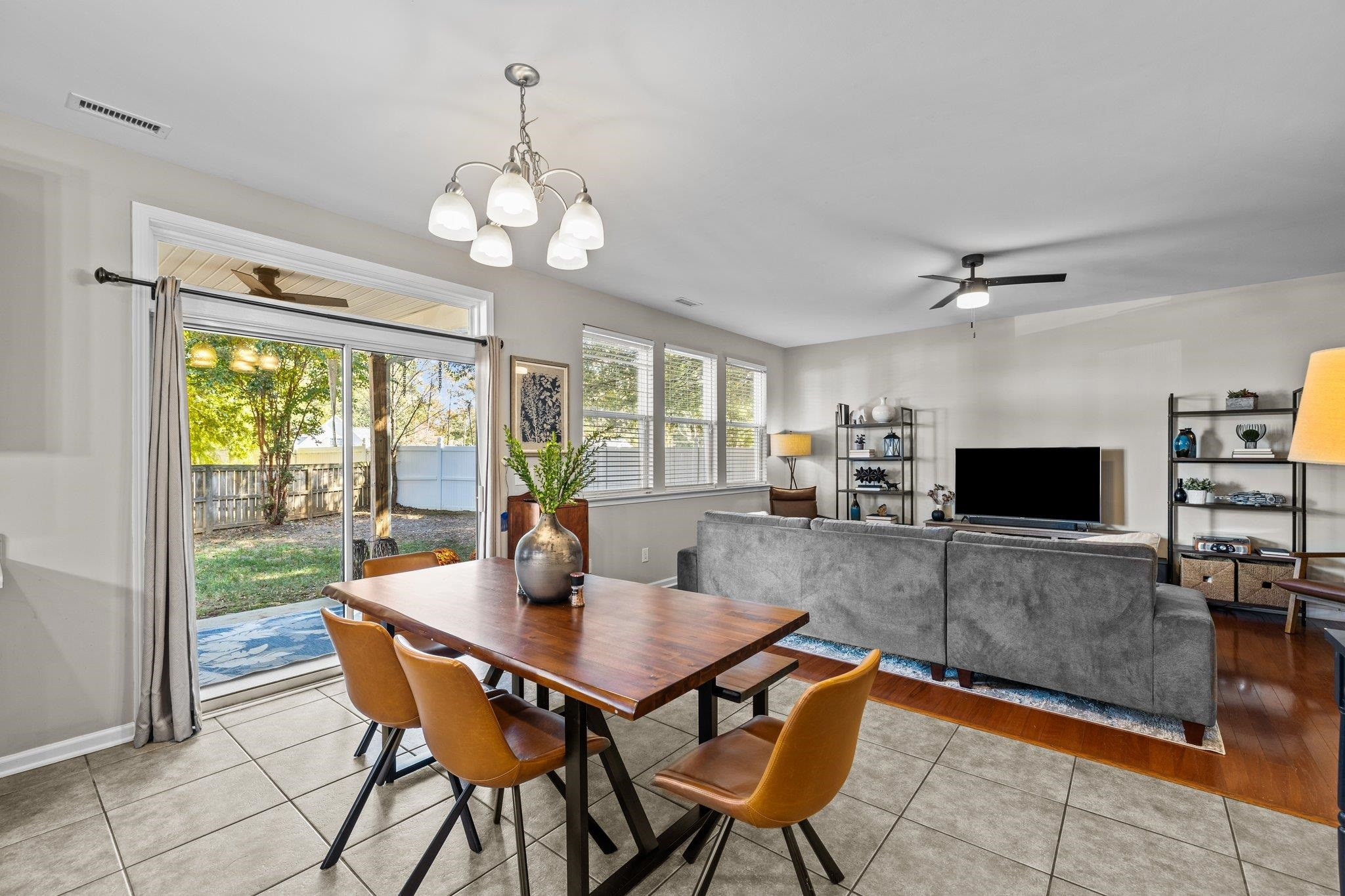 180 Solheim Lane Raleigh, NC 27603 - Photo 11 of 39 a view of a dining room with furniture window and wooden floor