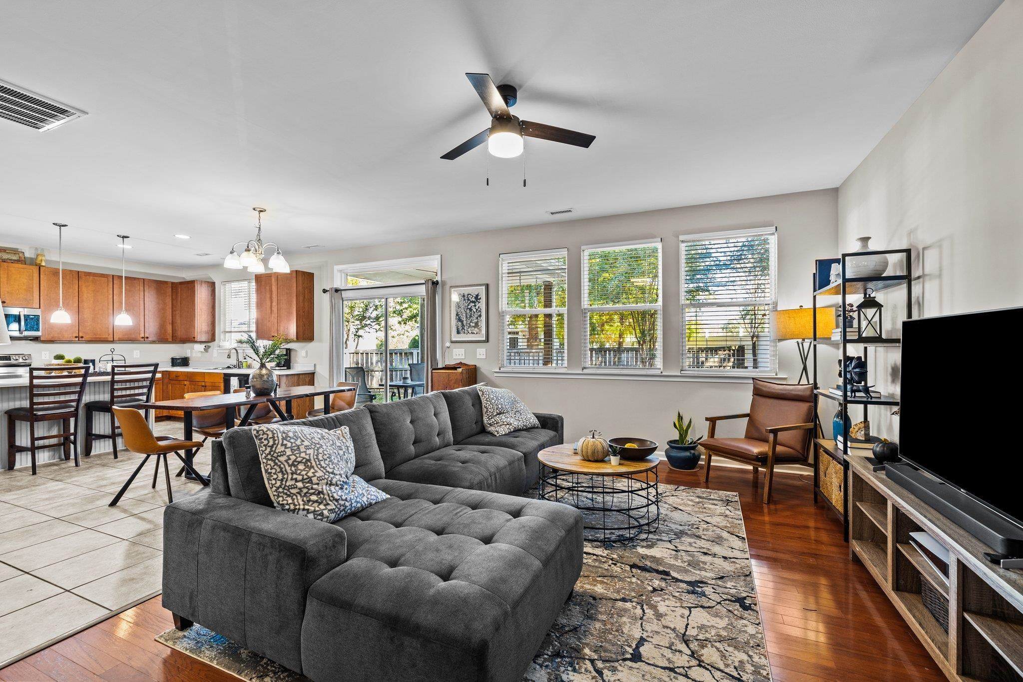 180 Solheim Lane Raleigh, NC 27603 - Photo 15 of 39 a living room with furniture kitchen view and a large window