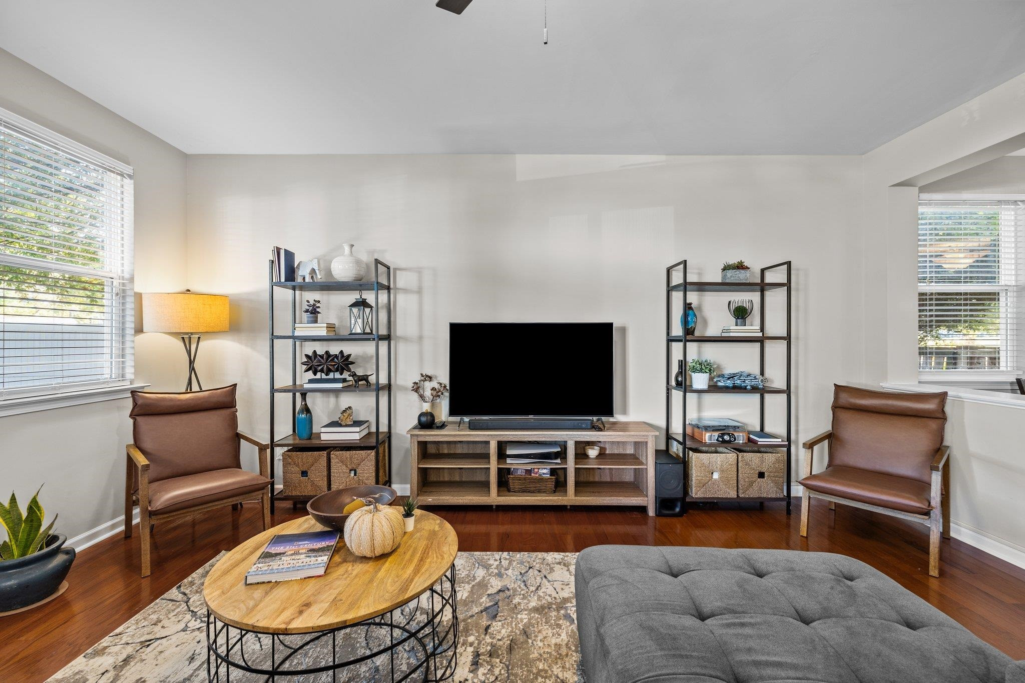 180 Solheim Lane Raleigh, NC 27603 - Photo 16 of 39 a living room with furniture and a flat screen tv