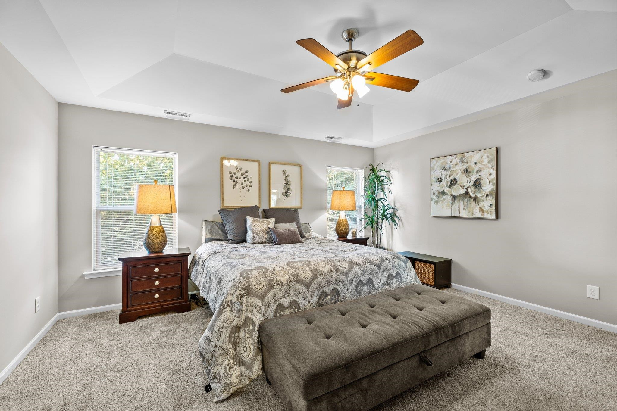 180 Solheim Lane Raleigh, NC 27603 - Photo 19 of 39 a bedroom with a bed and painting on the wall