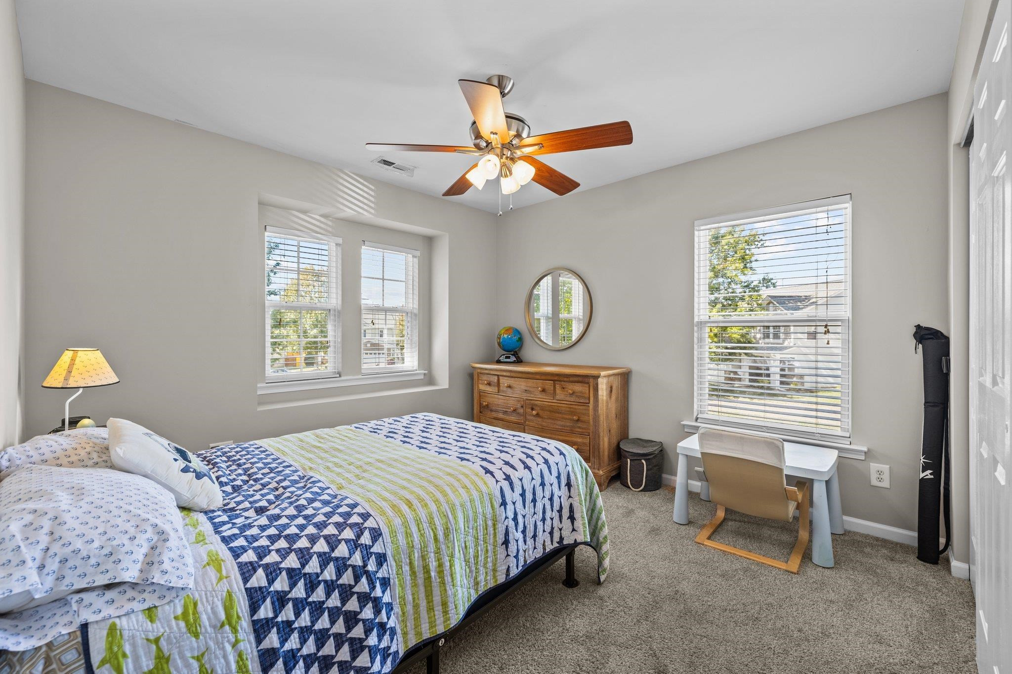 180 Solheim Lane Raleigh, NC 27603 - Photo 22 of 39 a bedroom with a bed and a window