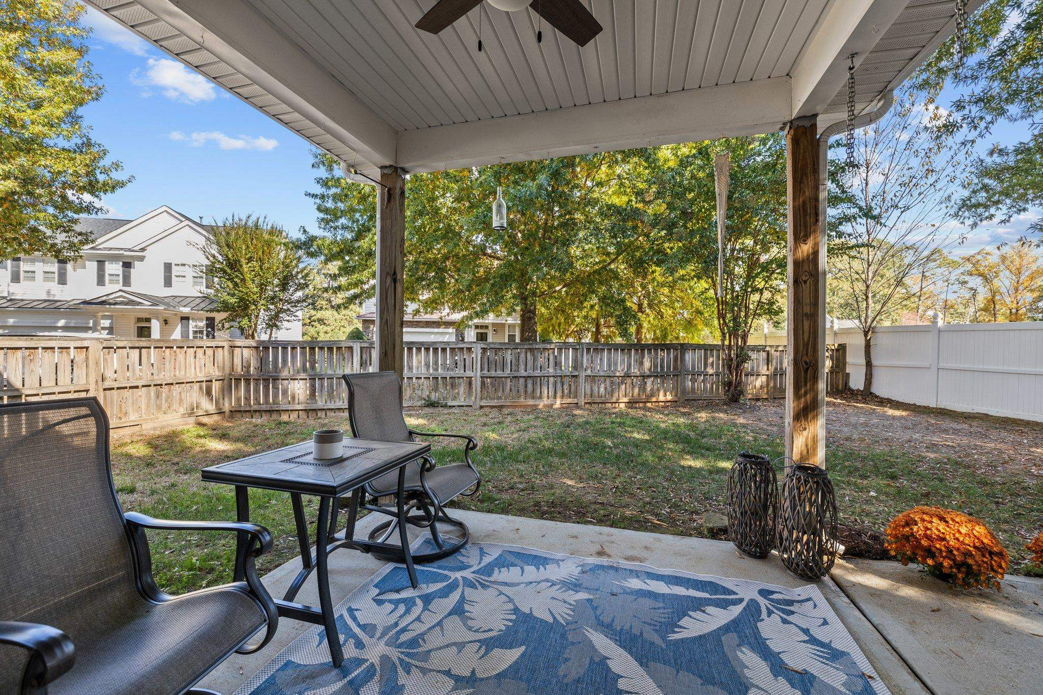 180 Solheim Lane Raleigh, NC 27603 - Photo 28 of 39 a view of a patio with table and chairs potted plants with wooden floor