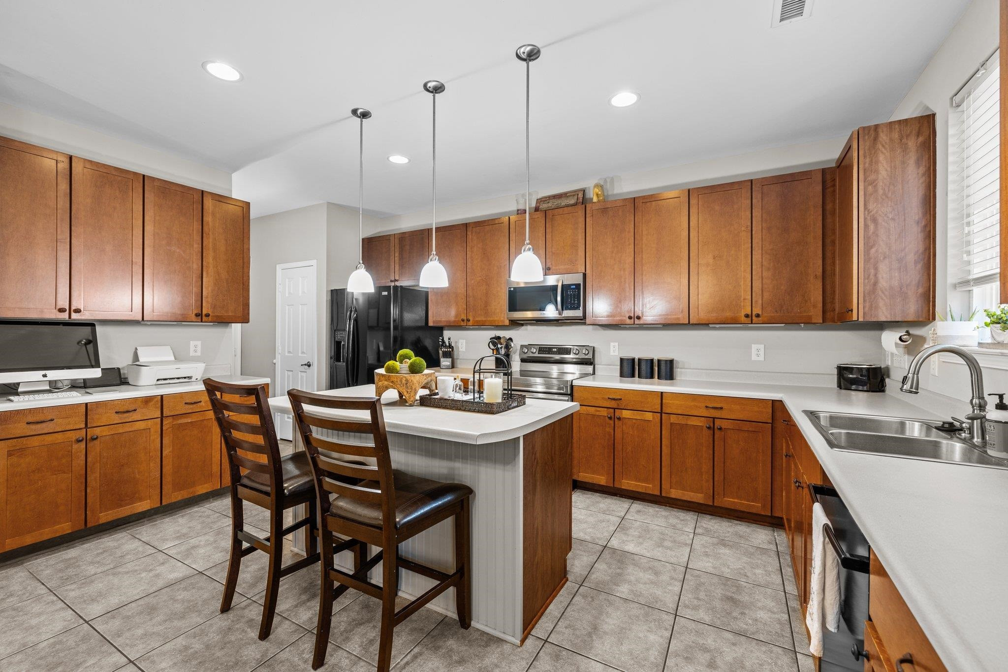 180 Solheim Lane Raleigh, NC 27603 - Photo 10 of 39 a kitchen with a sink a counter space appliances and cabinets