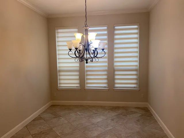 a view of a dining room with a window
