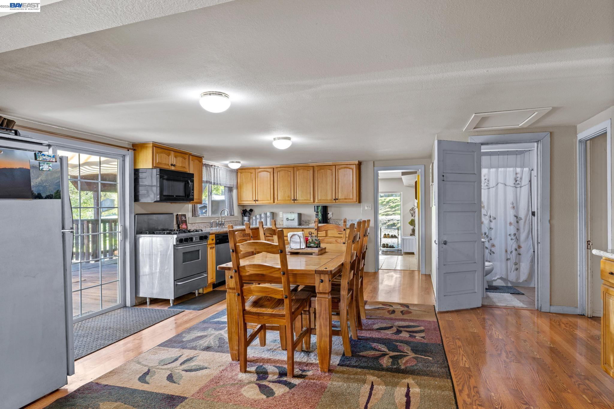 7777 Del Valle Road Livermore, CA 94550 - Photo 22 of 60 a view of a dining room with furniture window and wooden floor