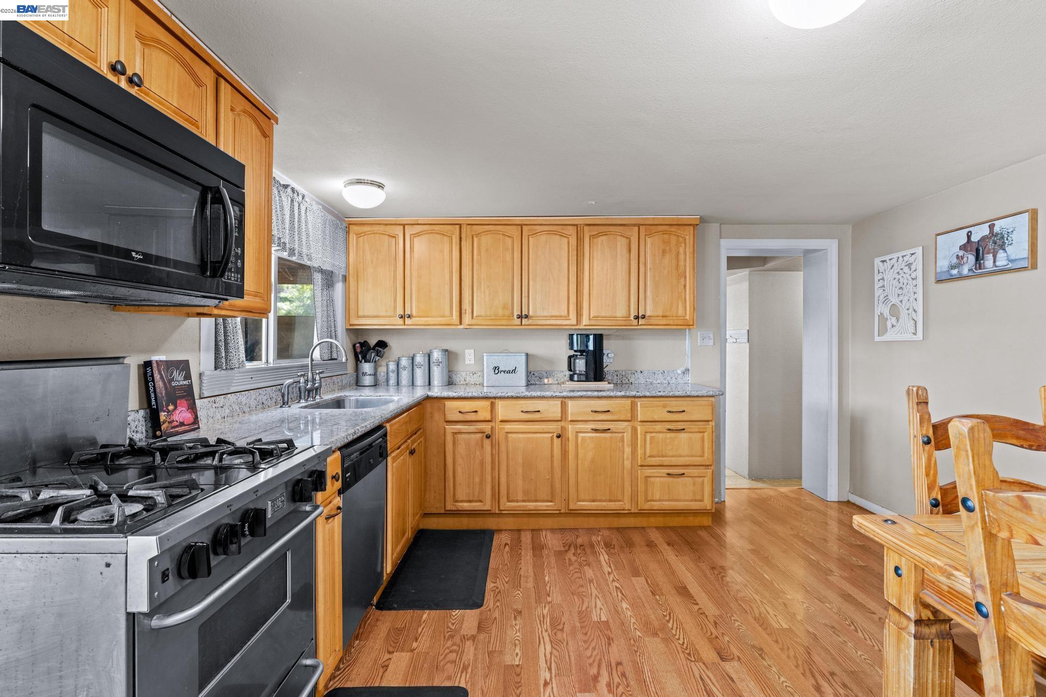 7777 Del Valle Road Livermore, CA 94550 - Photo 24 of 60 a kitchen with stainless steel appliances a stove a sink and a microwave