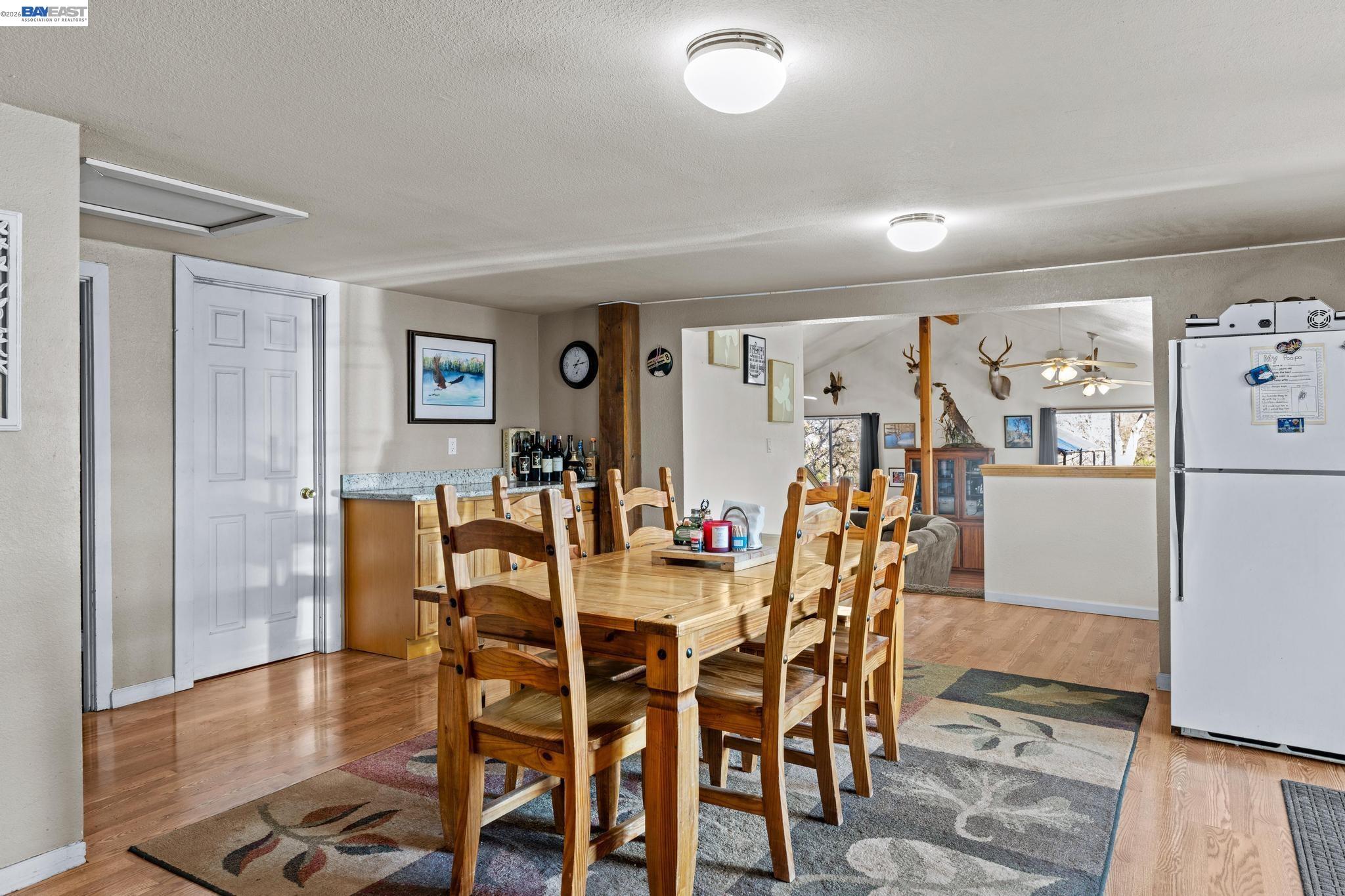 7777 Del Valle Road Livermore, CA 94550 - Photo 25 of 60 a view of a dining room with furniture and wooden floor